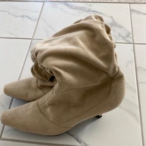 Cream/light tan boots with heel. Size 9.